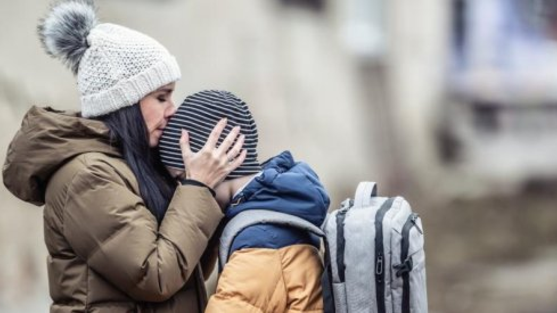 Adult comforting a child